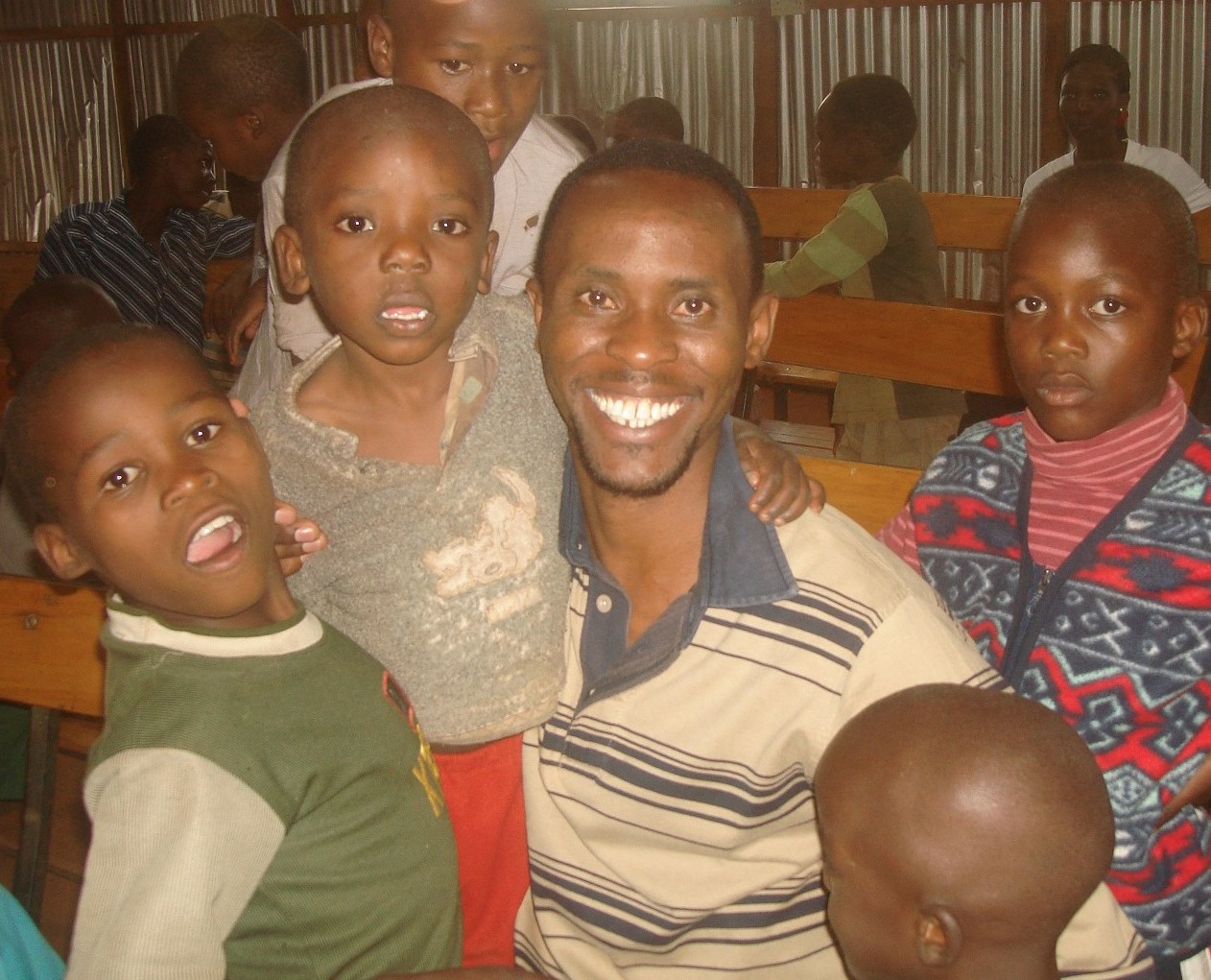 Sammy and children in the YCT Building Center