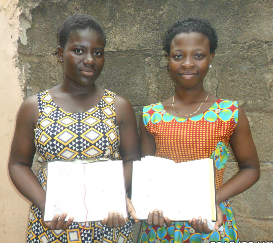 Girls receiving bibles