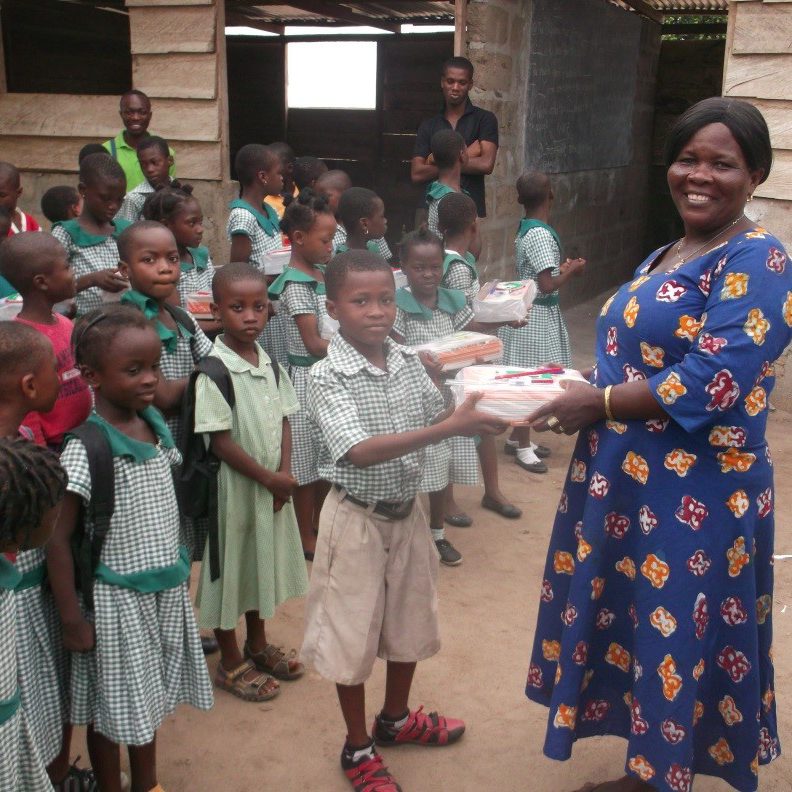 Most High Mission - children receiving exercise books
