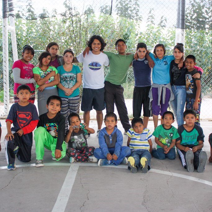Instructor Gabriel and a group of children from Casa Hogar Adonai orphange.