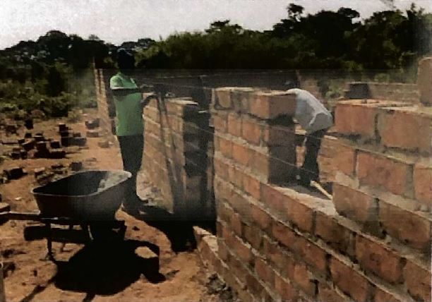 Construction on a home for Pastor Banda.