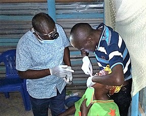 Dental extraction during a medical outreach. Over 1500 people were treated with medical care through collaboration with teams of 20-23 Christian clinicians, dentists, opticians, nurses, dispensers, laboratory technicians and evangelists.