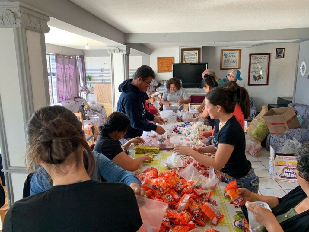 Adulam team packaging up gifts for outreach in the community.